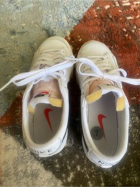 Nike women’s White Sneakers with black Swoosh